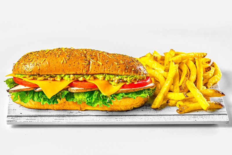 veggie sub sandwich with hummus and fresh greens
